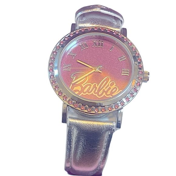 Barbie wrist watch with a metallic silver band adored with rhinestones. - Picture 1 of 4